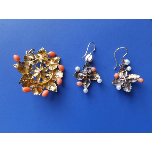 226 - A leaf cast yellow metal pendant and earrings set with coral & pearls, the pendant 1.75