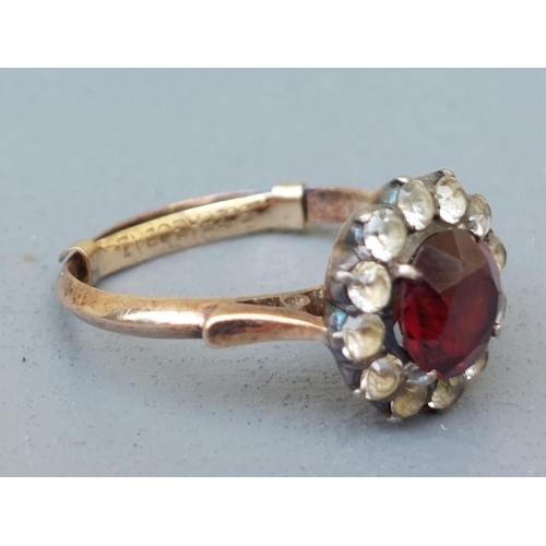 235 - A garnet & white sapphire cluster ring.