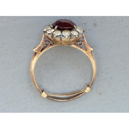 235 - A garnet & white sapphire cluster ring.