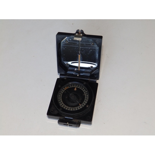 130 - A black bakelite military compass.