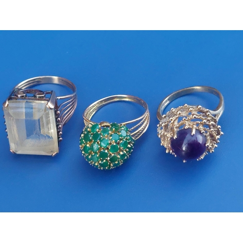 229 - Three gem set 9ct dress rings.