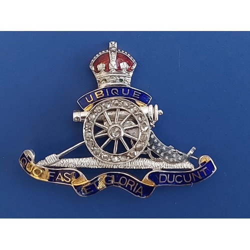 230 - A diamond set 18ct gold & platinum Royal Artillery sweetheart brooch, 1.3