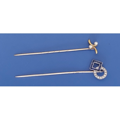 231 - A sapphire & diamond set stick pin and one other. (2)