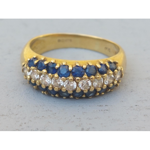 237 - A sapphire & diamond triple row 18ct gold band ring.  Finger size P.