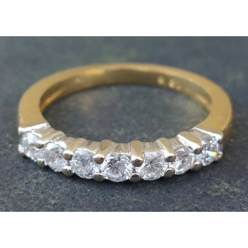 245 - A modern seven stone diamond in 18ct gold - total diamond weight 0.50 carat.  Finger size I/J.