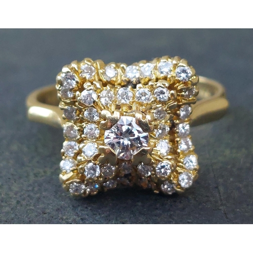 246 - A modern diamond cluster ring of shaped square form on 18ct gold shank.  Finger size M/N.