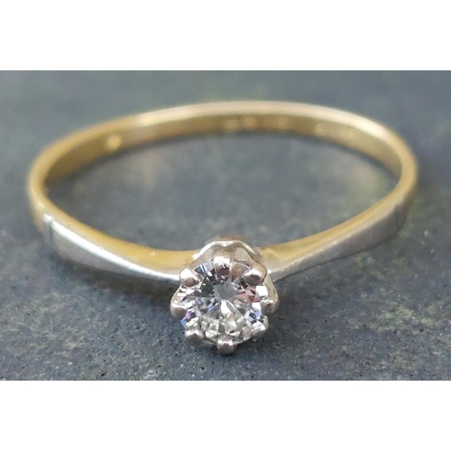 250 - A small diamond solitaire ring in 18ct & PLAT.  Finger size M.