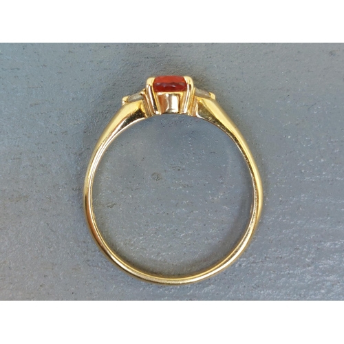 259 - A small Mexican fire opal & diamond three stone ring on 18ct gold shank.  Finger size Q.