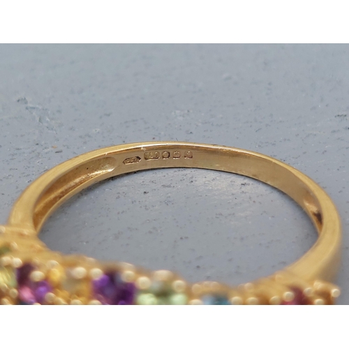 261 - A multi-stone tutti frutti 18ct gold ring - Sheffield marks.  Finger size P.