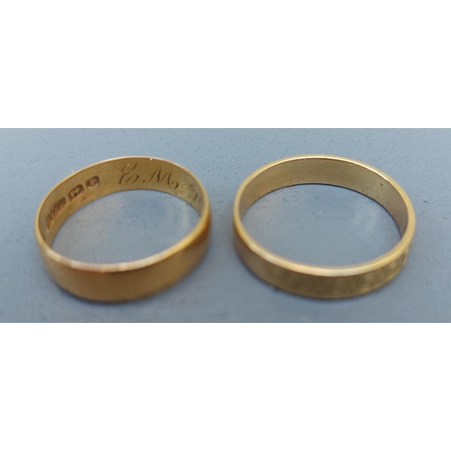 262 - A 22ct gold wedding ring with Birmingham marks and a French decorated French gold wedding ring. (2)