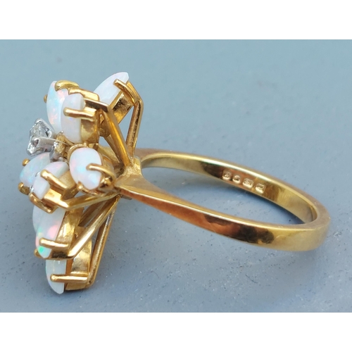 263 - A modern opal & diamond ring of eccentric cluster design in 18ct gold - London marks.  Finger size L... 