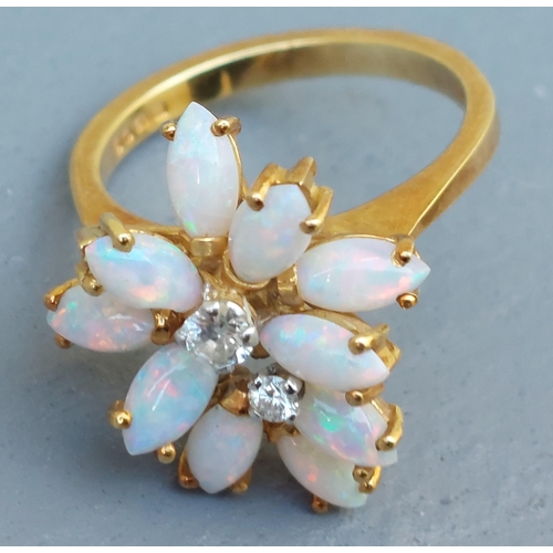 263 - A modern opal & diamond ring of eccentric cluster design in 18ct gold - London marks.  Finger size L... 