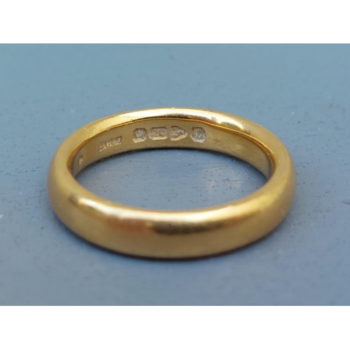 268 - A heavy 22 carat gold wedding ring - Chester marks.  Finger size P.