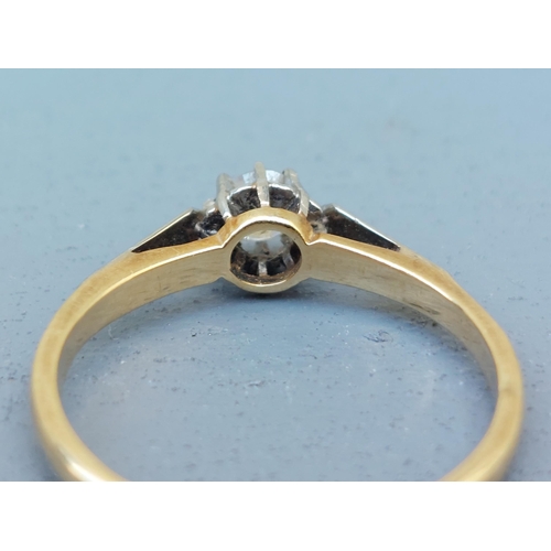 270 - A small solitaire diamond ring in 18ct & PLAT.  Finger size N/O.