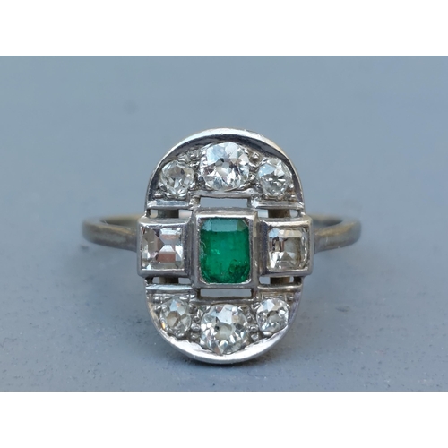 271 - An emerald & old cut diamond oval panel ring in white metal.  Finger size R/S.