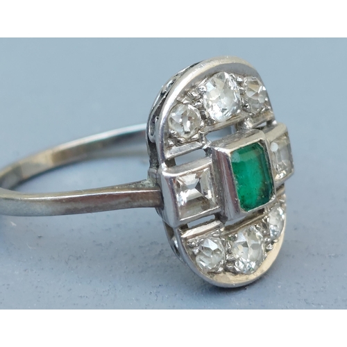 271 - An emerald & old cut diamond oval panel ring in white metal.  Finger size R/S.