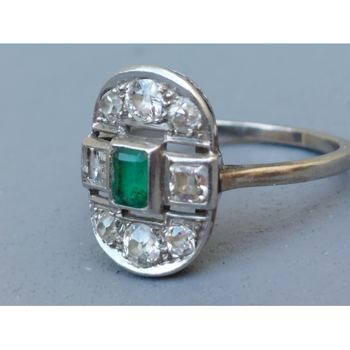 271 - An emerald & old cut diamond oval panel ring in white metal.  Finger size R/S.