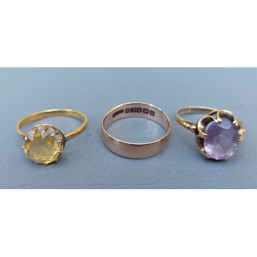 273 - A 9ct gold wedding ring and two single stone 9ct rings. (3)