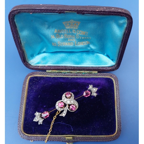 312 - An Edwardian ruby & rose cut diamond bar brooch, having shamrock design to centre and fleur de lys e... 