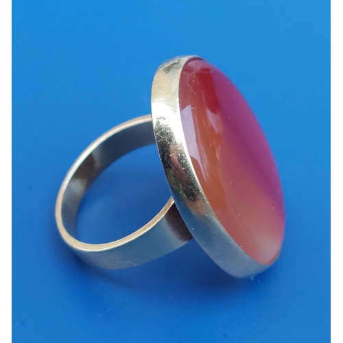 314 - A large agate set  yellow 750 ring, the oval stone panel 30mm across - 'BB'.  Finger size S.