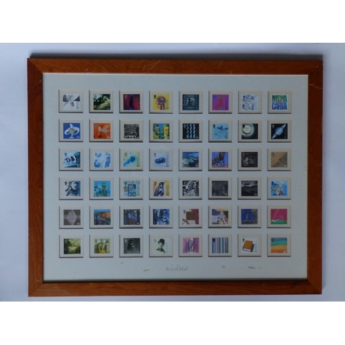 17 - A framed Royal Mail display of 48 pictorial QEII Millenium postage stamps.