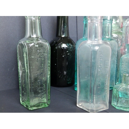 26 - A collection of 15 small glass bottles, including beer bottles and others, two from Hancock of Wivel... 