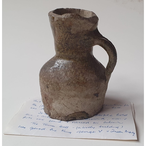 33 - A Medieval glazed pottery jug, with written note stating it was discovered during the building of No... 