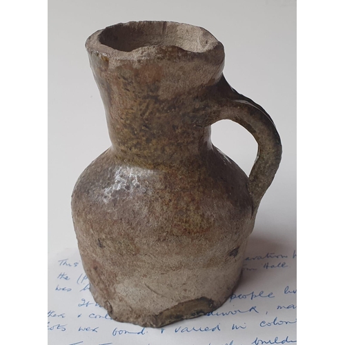 33 - A Medieval glazed pottery jug, with written note stating it was discovered during the building of No... 