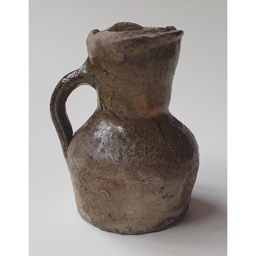 33 - A Medieval glazed pottery jug, with written note stating it was discovered during the building of No... 