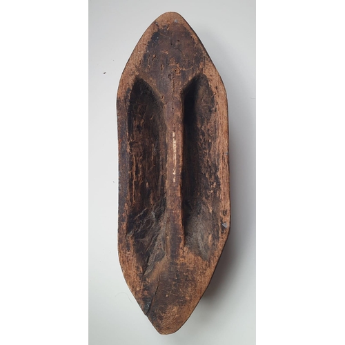 70 - A carved wood Aboriginal shield with painted decoration, 18.5