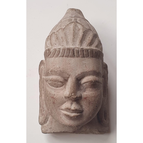 75 - An Indian carved stone bust, 5.25