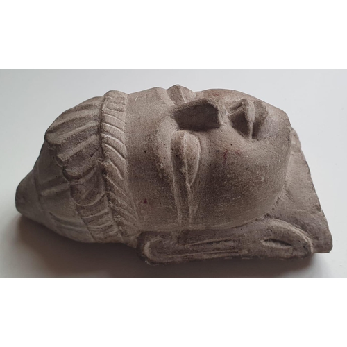 75 - An Indian carved stone bust, 5.25