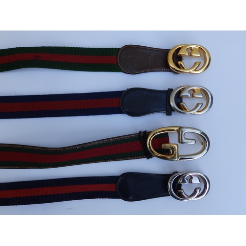 49 - Four Gucci web belts , 31