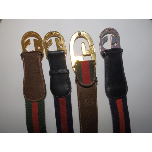 49 - Four Gucci web belts , 31