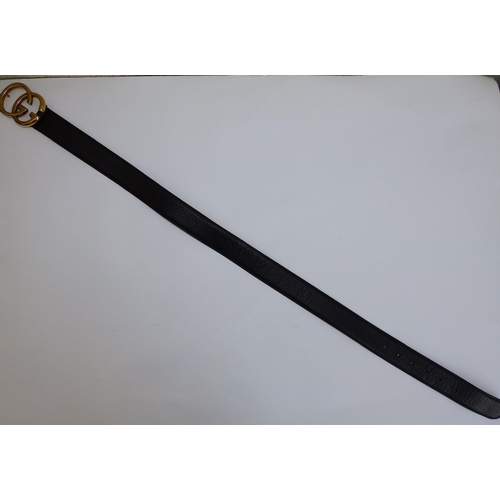 54 - A black leather Gucci belt with bold gilt metal GG buckle, 37.5