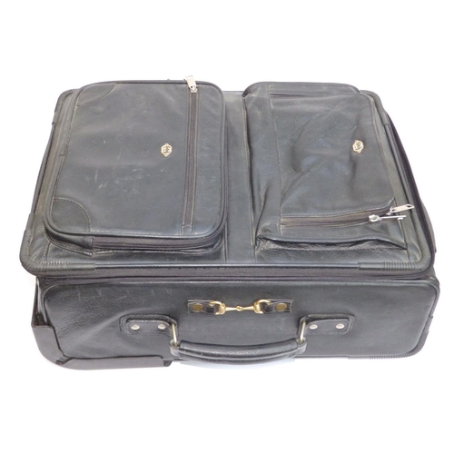 55 - A Gucci black leather travel case on wheels, 20