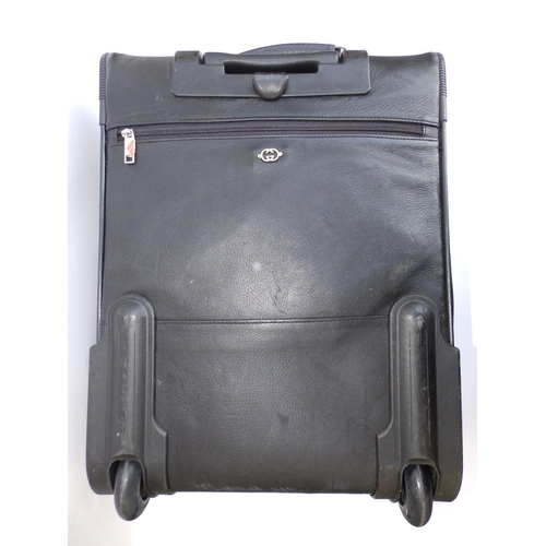 55 - A Gucci black leather travel case on wheels, 20