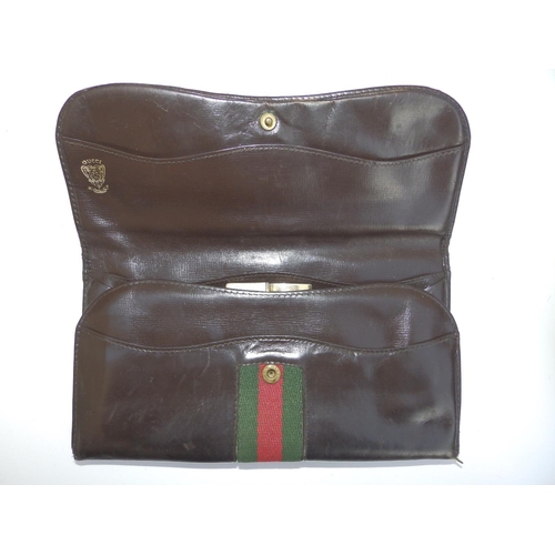 56 - A brown leather Gucci web pattern purse, 7.5