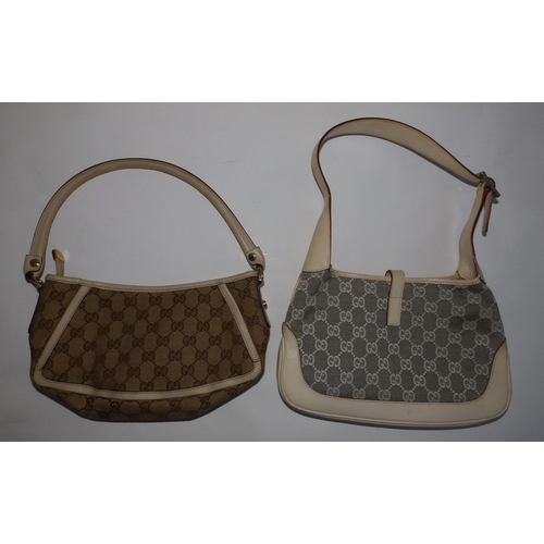 57 - Two cream canvas & leather Gucci handbags,  10.5