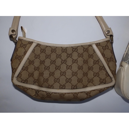 57 - Two cream canvas & leather Gucci handbags,  10.5