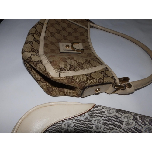 57 - Two cream canvas & leather Gucci handbags,  10.5