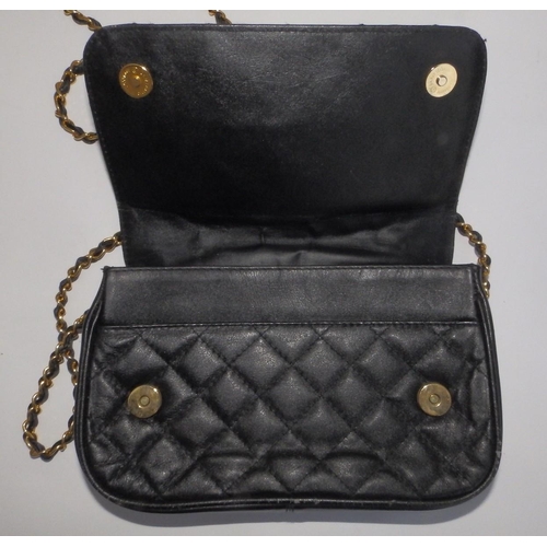 61 - A Chanel quilted black leather shoulder bag, bold interlaced C's to flap, on gilt metal & leather st... 