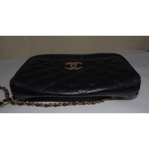 61 - A Chanel quilted black leather shoulder bag, bold interlaced C's to flap, on gilt metal & leather st... 