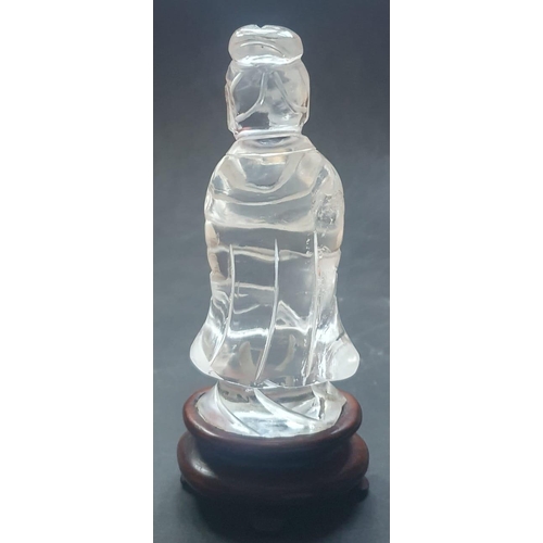 66 - A Chinese rock crystal figure on wooden stand, 5