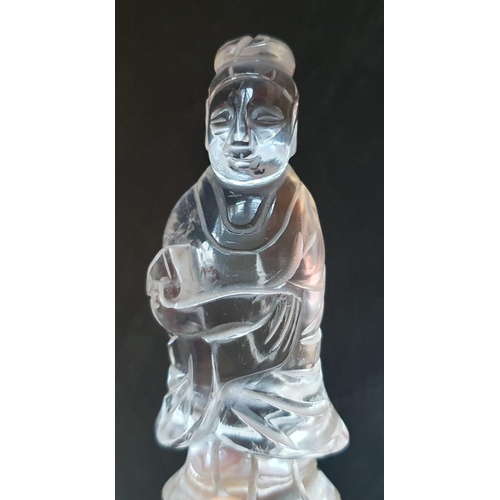 66 - A Chinese rock crystal figure on wooden stand, 5