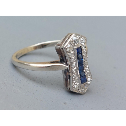 151 - A sapphire & diamond pave set panel ring of waisted rectangular form - tests as platinum.  Finger si... 