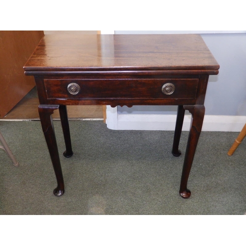 80 - A small Georgian folding mahogany tea table, with frieze drawer, round section legs to pad feet, Wid... 