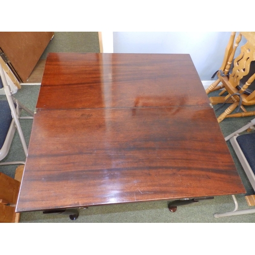 80 - A small Georgian folding mahogany tea table, with frieze drawer, round section legs to pad feet, Wid... 