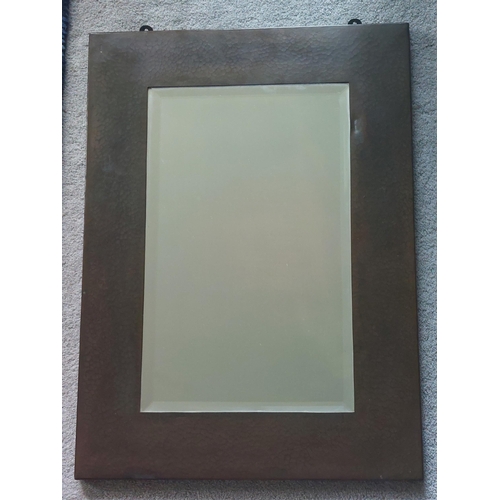 83 - A plain rectangular beaten copper 'Newlyn' wall mirror, 22.5