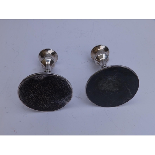 95 - A small pair of  silver tapersticks - Birmingham 1910/11,  4.25